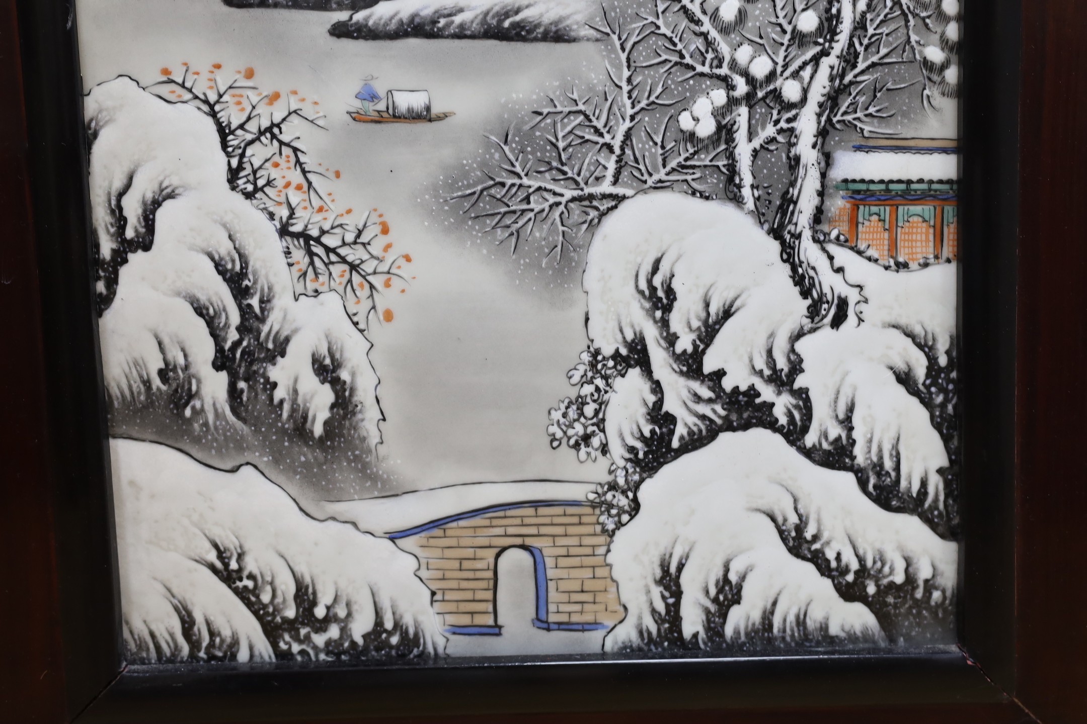 A Chinese framed porcelain plaque decorated with a winter scene, 31 cms wide x 54 cms high (not including frame)